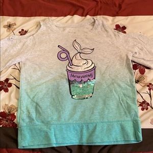 A ombré off the shoulders sweater